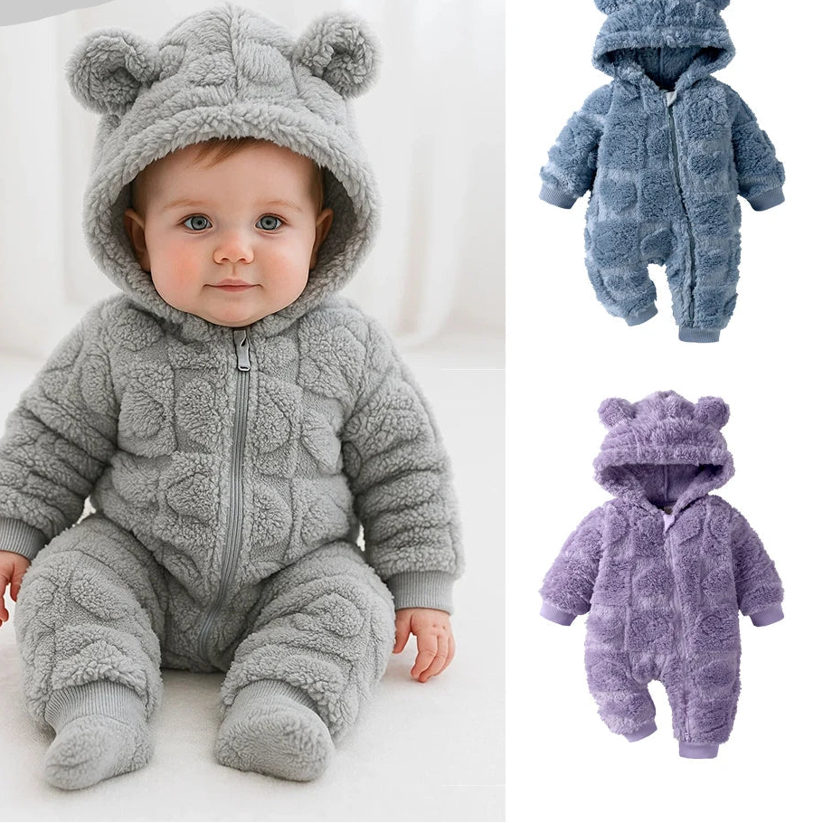 Baby in a gray fleece romper with bear ears, surrounded by additional rompers in blue and purple.